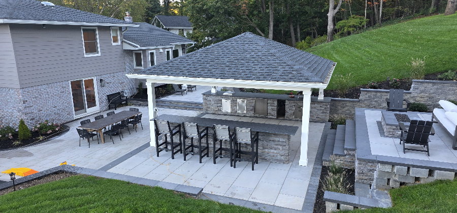 outdoor kitchen with pergola and MSI stacked stone coal canyon